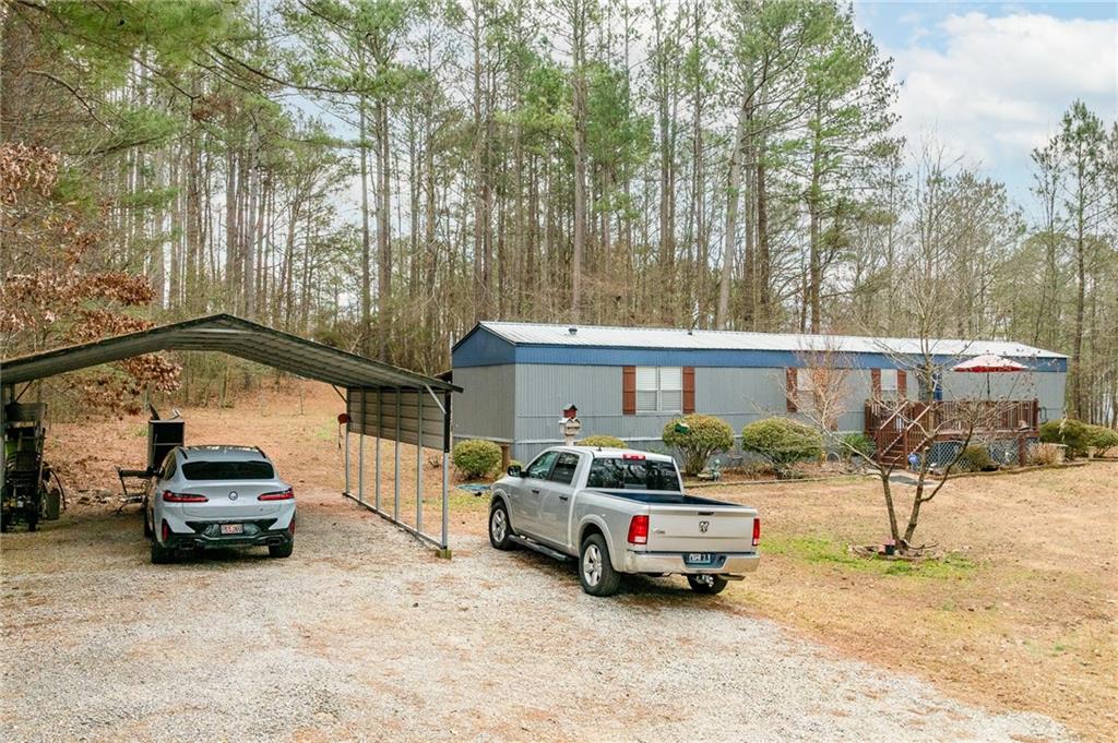 224 Hebron Road Commerce, GA 30530 - Photo 2 of 25 a car parked in front of a house