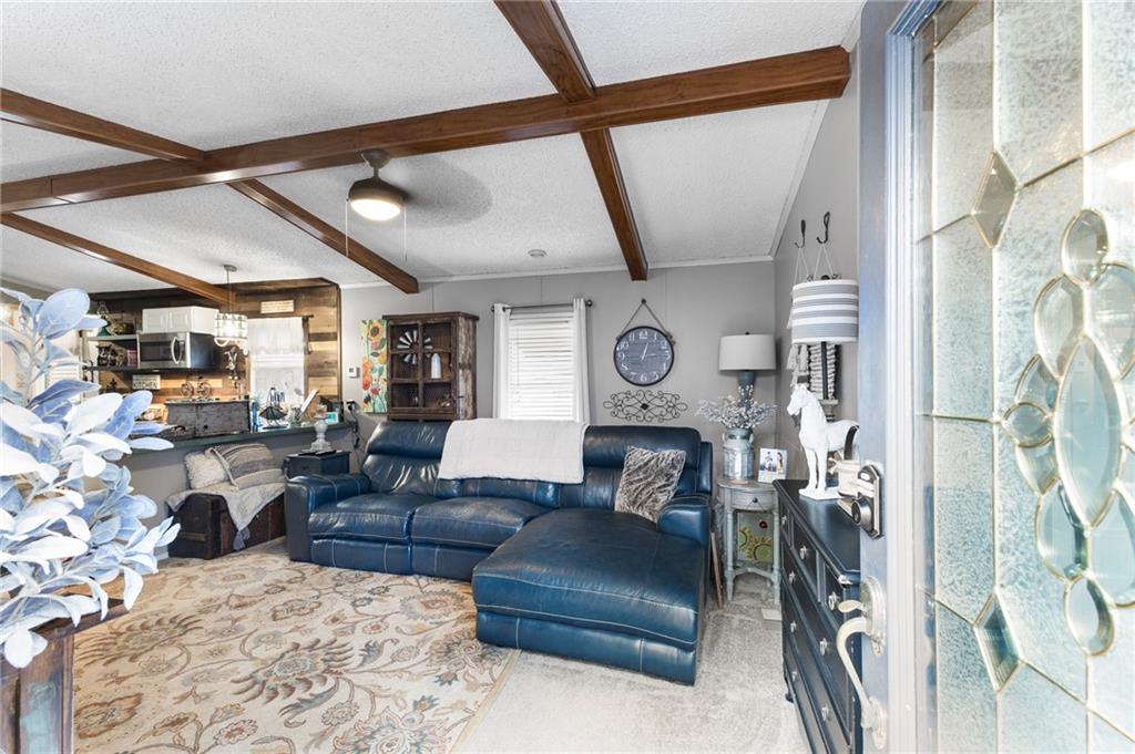 224 Hebron Road Commerce, GA 30530 - Photo 3 of 25 a living room with furniture and a window