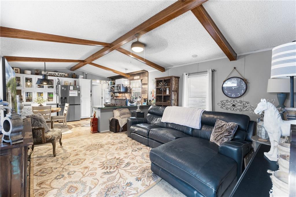 224 Hebron Road Commerce, GA 30530 - Photo 4 of 25 a living room with furniture and a large window