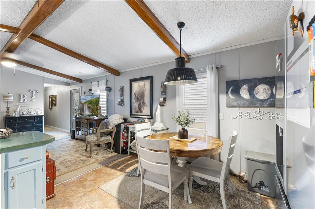 224 Hebron Road Commerce, GA 30530 - Photo 7 of 25 a view of a dining room with furniture and wooden floor