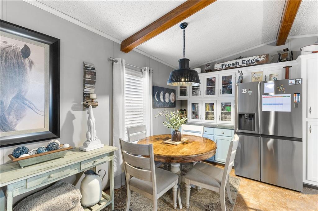 224 Hebron Road Commerce, GA 30530 - Photo 8 of 25 a dining room with furniture and chandelier