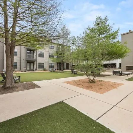 a building with trees in front of it