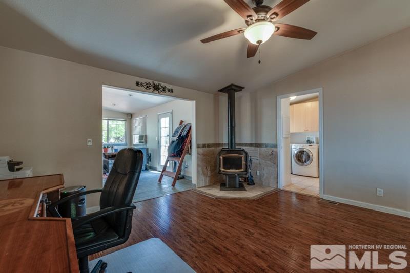4989 Cody Road Fallon, NV 89406 - Photo 11 of 39 a view of a workspace with furniture and a window