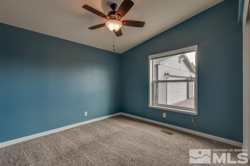 4989 Cody Road Fallon, NV 89406 - Photo 16 of 39 an empty room with a window and a fan