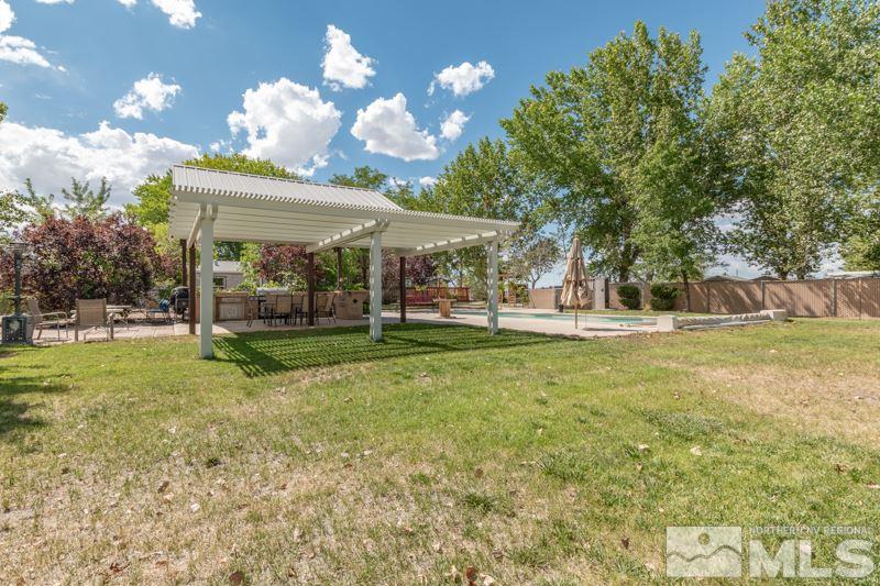 4989 Cody Road Fallon, NV 89406 - Photo 28 of 39 a view of a house with a backyard porch and sitting area