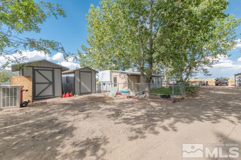 4989 Cody Road Fallon, NV 89406 - Photo 30 of 39 a view of a house with a yard and tree