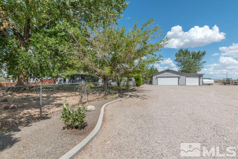 4989 Cody Road Fallon, NV 89406 - Photo 31 of 39 a view of a street with a bench in front of it