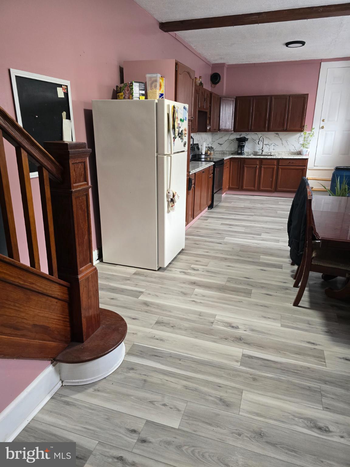 1237 Cotton Street Reading, PA 19602 - Photo 11 of 11 a kitchen with stainless steel appliances kitchen island granite countertop a refrigerator a stove a sink and a cabinets
