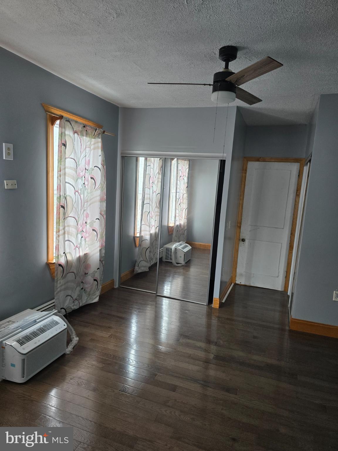 1237 Cotton Street Reading, PA 19602 - Photo 7 of 11 a view of a livingroom with wooden floor and a window