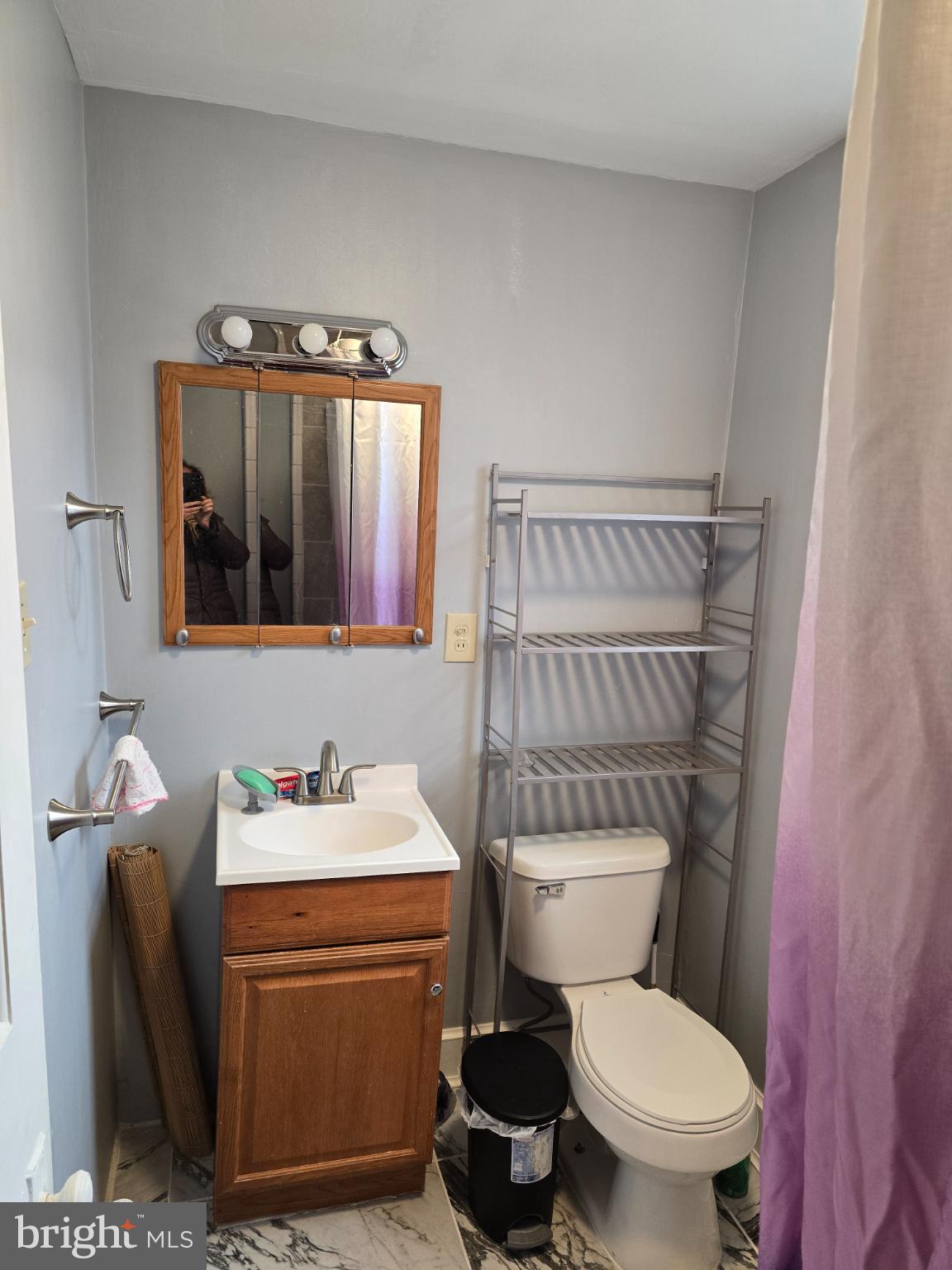 1237 Cotton Street Reading, PA 19602 - Photo 9 of 11 a bathroom with a sink toilet and mirror