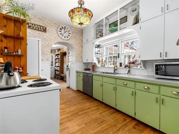a kitchen with cabinets and window