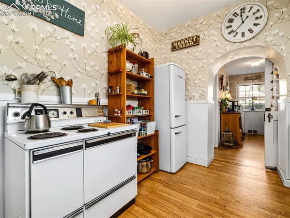 a kitchen with a sink and a refrigerator