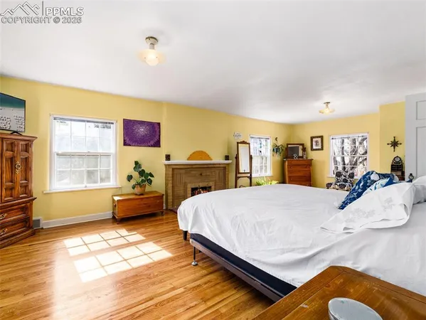 a bed room with a bed and a chair