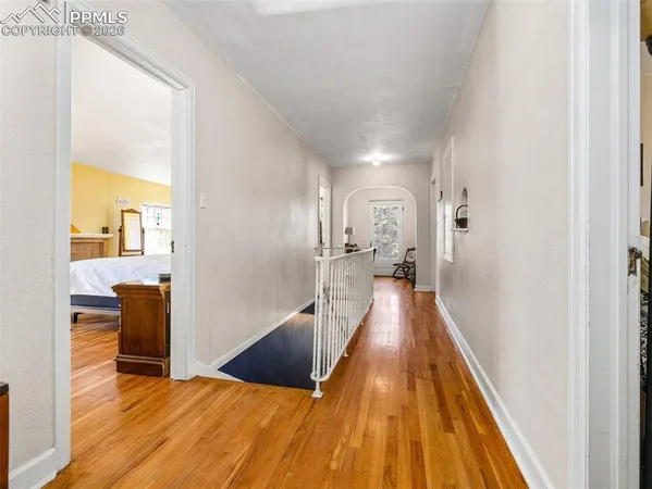 a view of a living room with a wooden floor