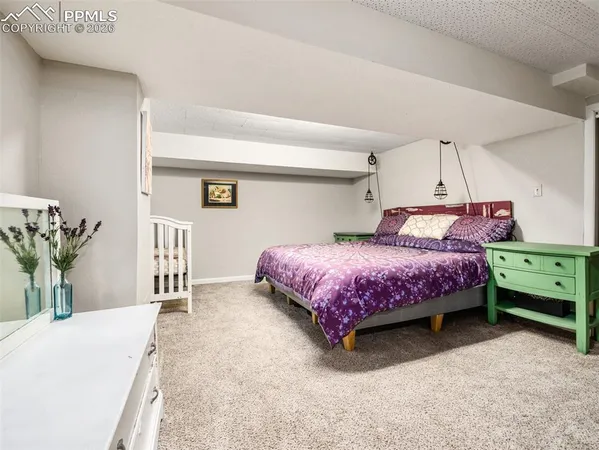a bedroom with a bed and a table