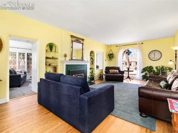 a living room with furniture and a fireplace