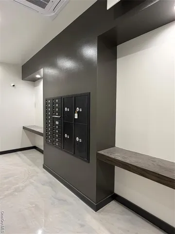 a kitchen with granite countertop a refrigerator a stove a microwave and island