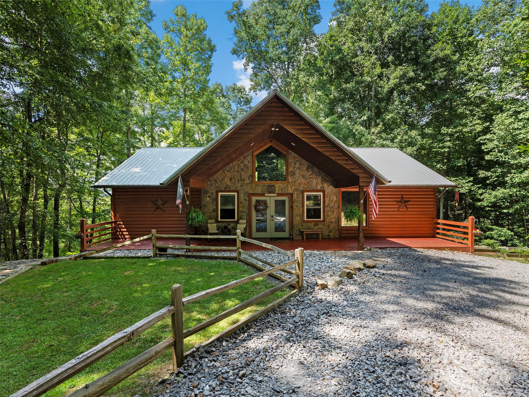 25 Dawn Valley Road Waynesville, NC 28785 - Photo 1 of 46 a front view of a house with a yard