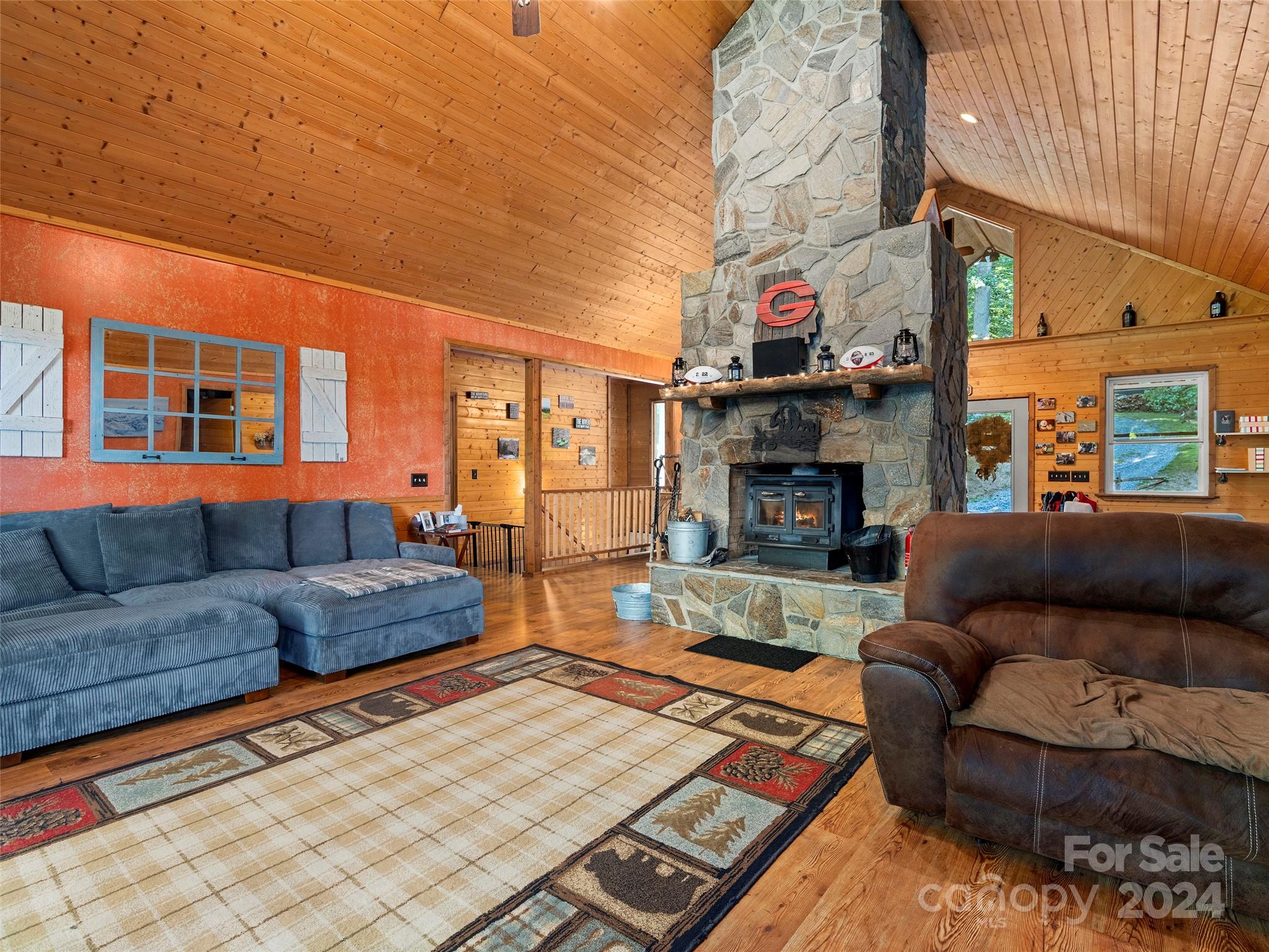 25 Dawn Valley Road Waynesville, NC 28785 - Photo 11 of 46 a living room with furniture and a fireplace