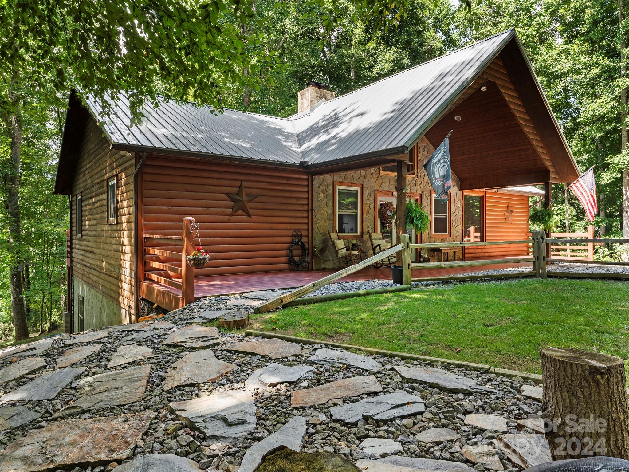 25 Dawn Valley Road Waynesville, NC 28785 - Photo 2 of 46 a front view of a house with garden