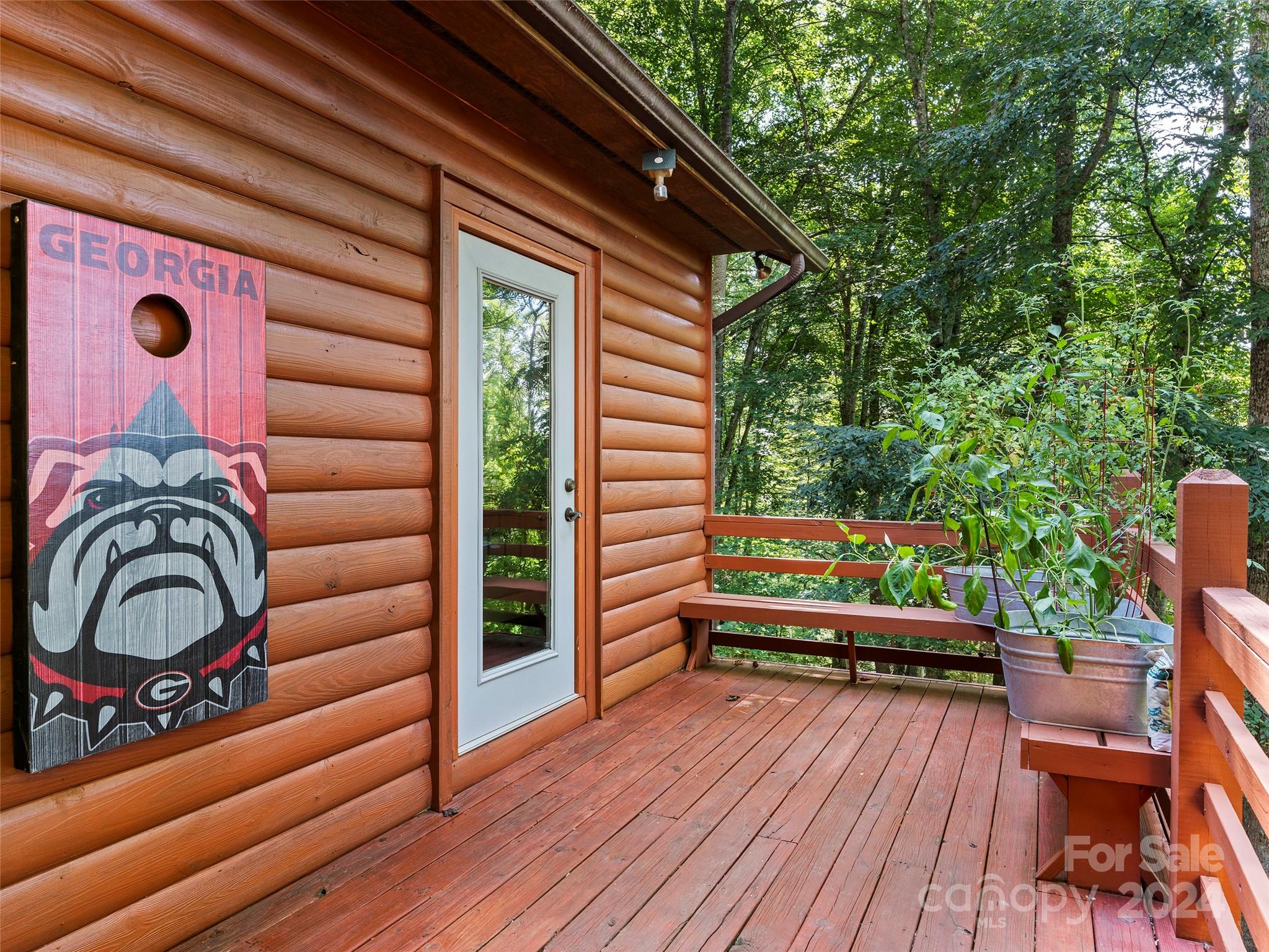 25 Dawn Valley Road Waynesville, NC 28785 - Photo 24 of 46 a view of a wooden chairs in a balcony