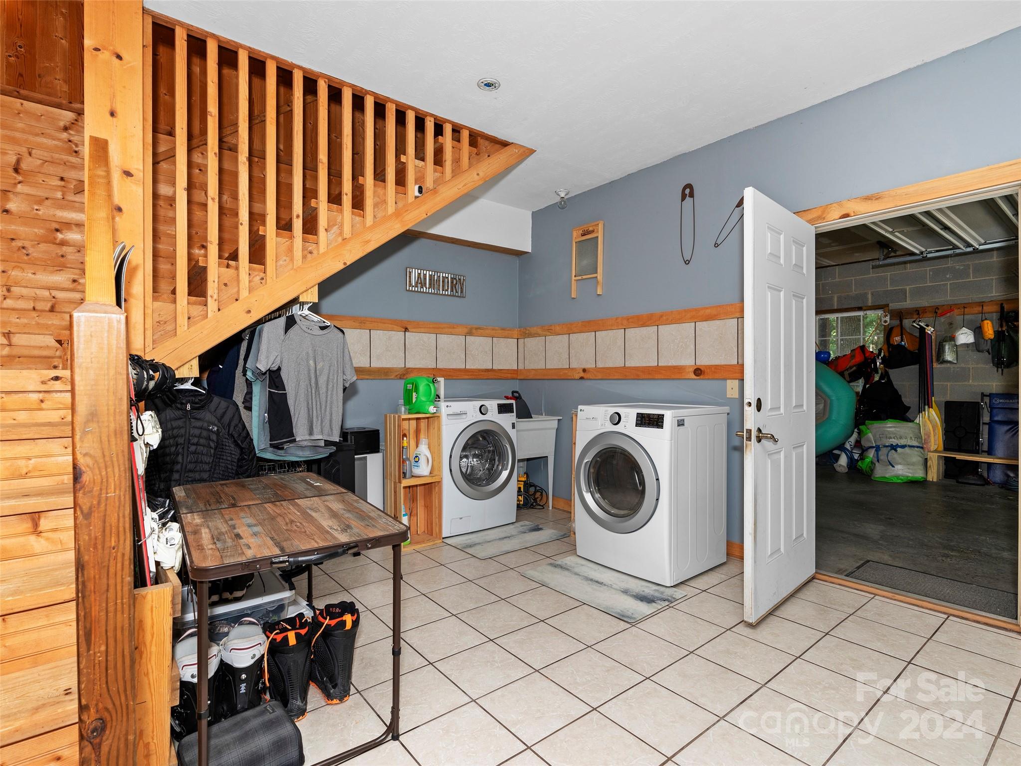 25 Dawn Valley Road Waynesville, NC 28785 - Photo 26 of 46 a utility room with dryer and washer