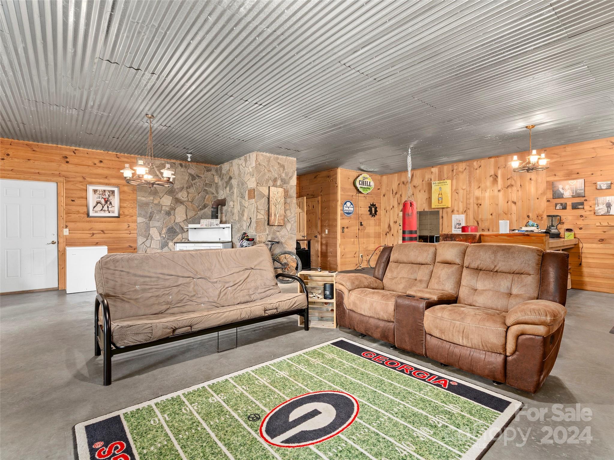 25 Dawn Valley Road Waynesville, NC 28785 - Photo 28 of 46 a living room with furniture and a rug