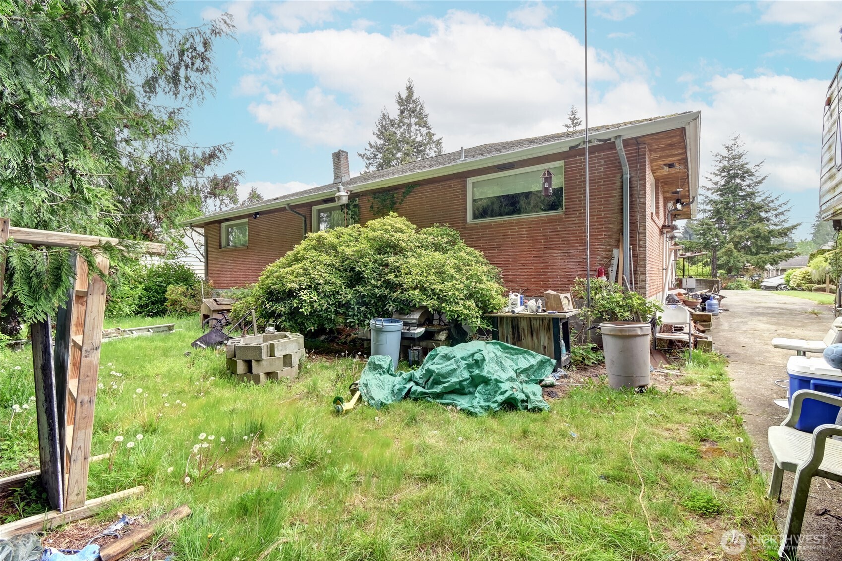 431 72nd Street Southeast Everett, WA 98203 - Photo 9 of 14 a backyard of a house with outdoor seating and plants