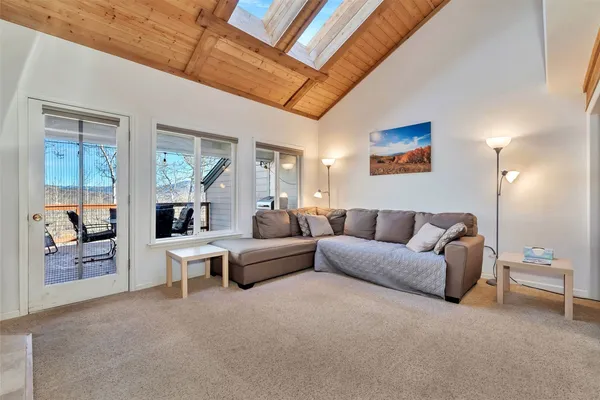 a living room with furniture and a table