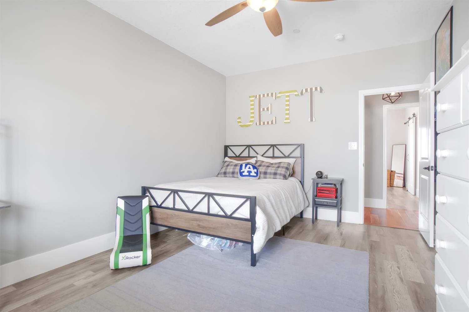 7991 South Shingle Road Shingle Springs, CA 95682 - Photo 40 of 58 a bedroom with a bed and a chandelier