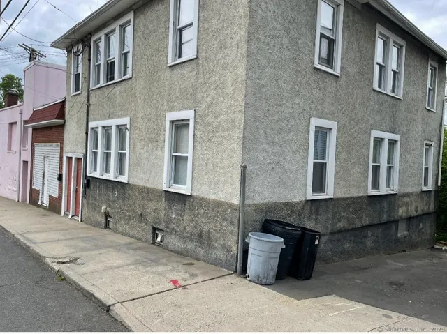 a front view of a house with many windows