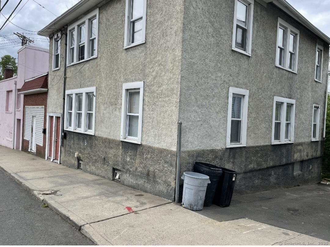 a front view of a house with many windows