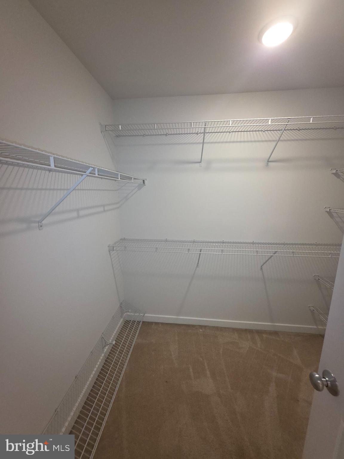 12709 Vuillard Street Silver Spring, MD 20906 - Photo 12 of 28 a view of a room with racks on the wall