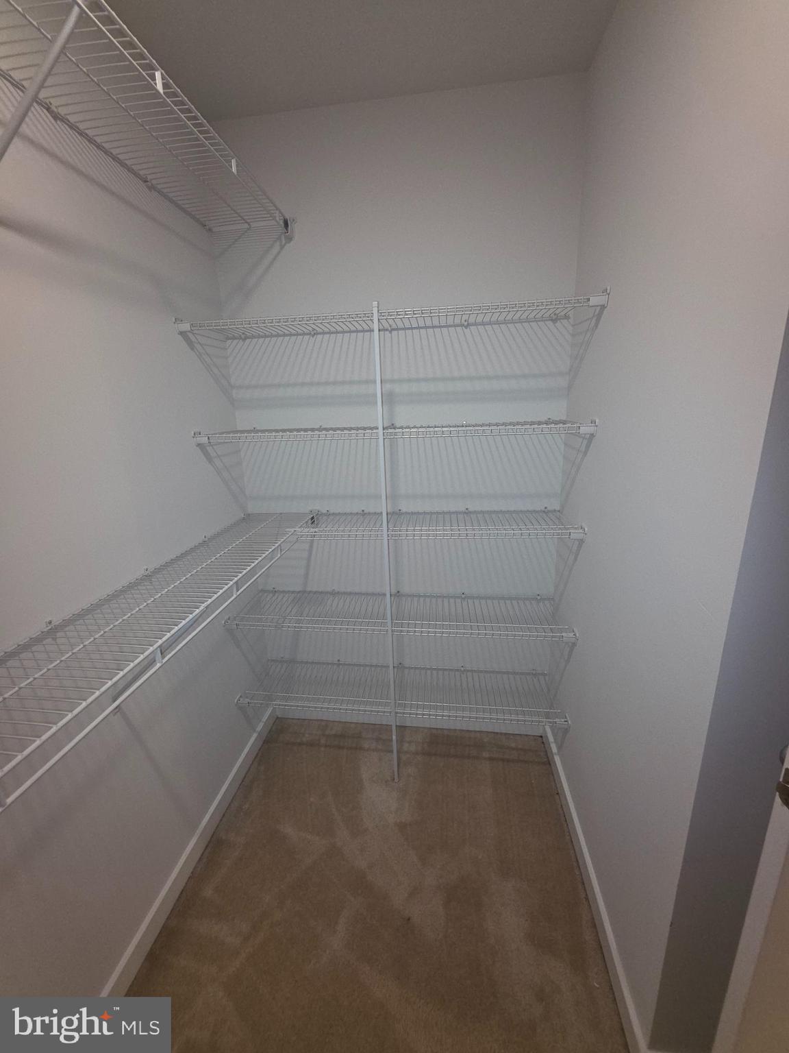 12709 Vuillard Street Silver Spring, MD 20906 - Photo 13 of 28 a view of a room with racks on the wall