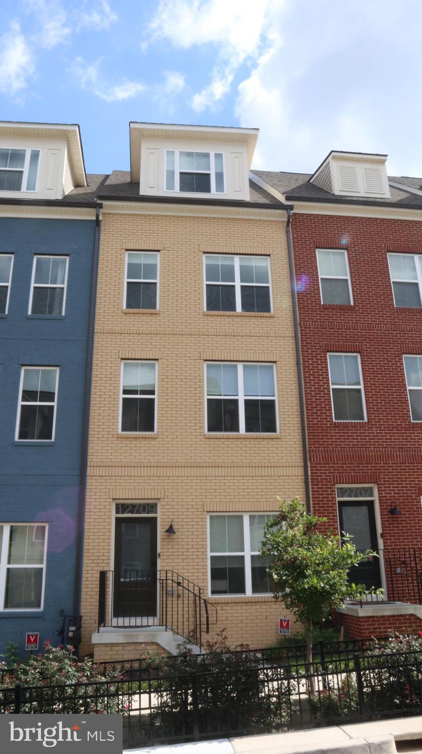 12709 Vuillard Street Silver Spring, MD 20906 - Photo 2 of 28 a large building with a lot of windows