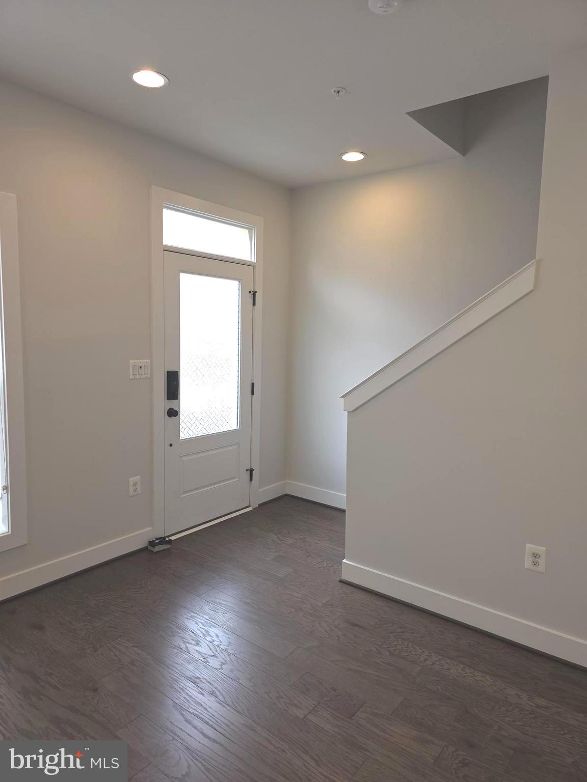 12709 Vuillard Street Silver Spring, MD 20906 - Photo 23 of 28 an empty room with wooden floor and windows