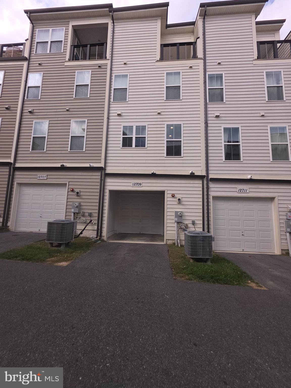 12709 Vuillard Street Silver Spring, MD 20906 - Photo 27 of 28 a view of a building with a street