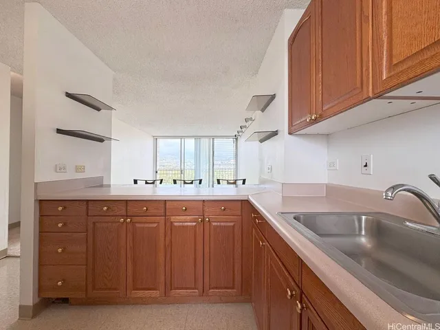 a kitchen with a sink and cabinets
