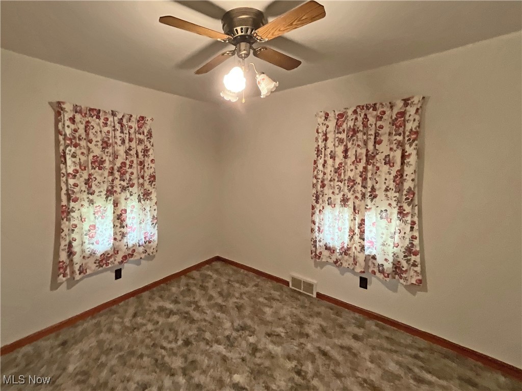 63 Mc Coll Road Colliers, WV 26035 - Photo 5 of 17 Carpeted spare room featuring ceiling fan