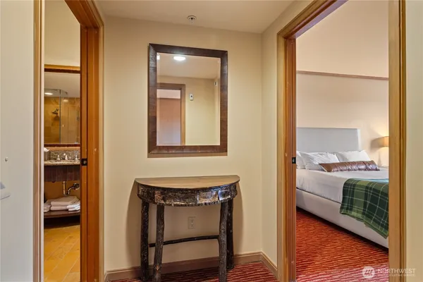 a view of a bedroom from a hallway