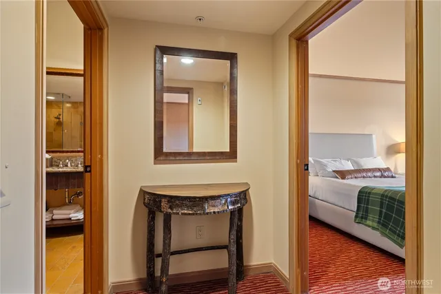 a view of a bedroom from a hallway