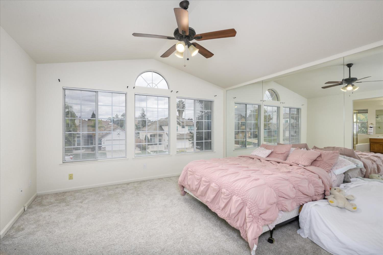 5636 Darby Road Rocklin, CA 95765 - Photo 16 of 29 a bedroom with a bed and a large window