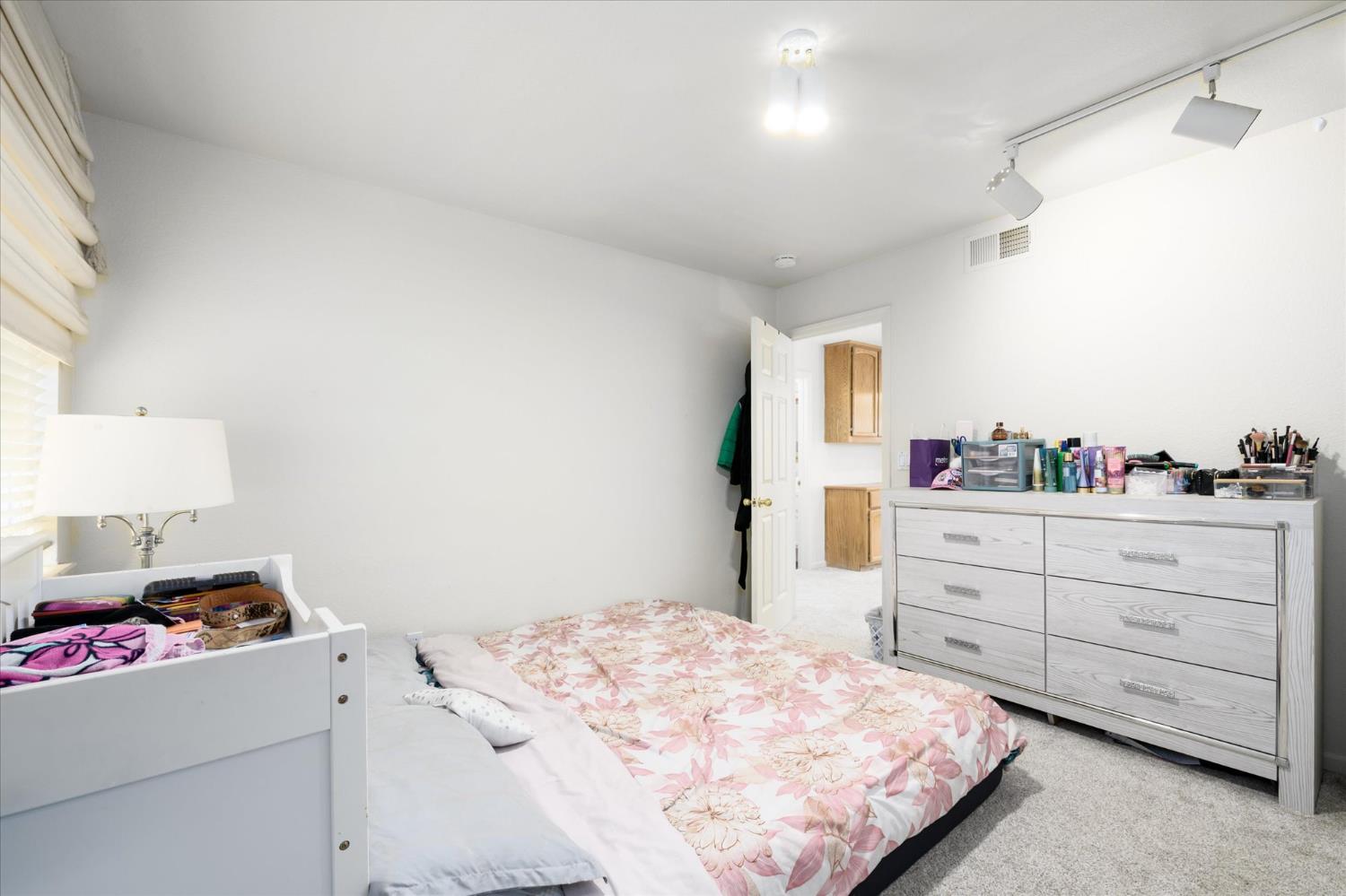 5636 Darby Road Rocklin, CA 95765 - Photo 21 of 29 a bedroom with a bed and a dresser