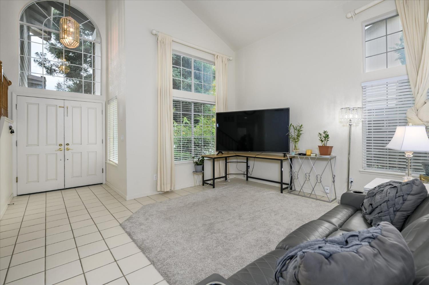 5636 Darby Road Rocklin, CA 95765 - Photo 4 of 29 a living room with furniture and a flat screen tv