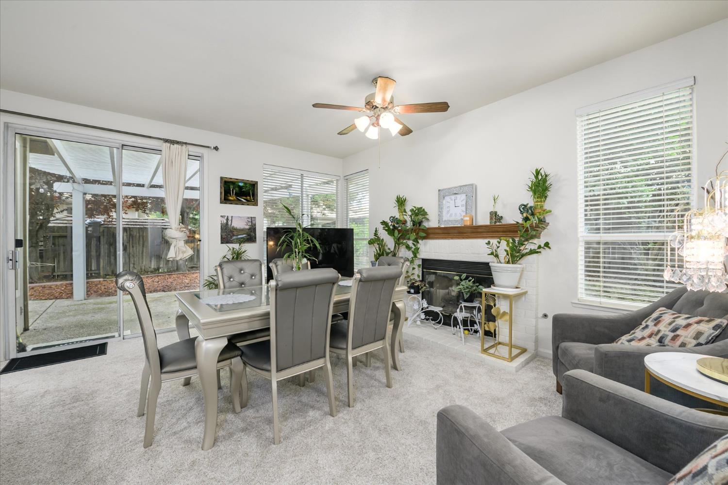5636 Darby Road Rocklin, CA 95765 - Photo 10 of 29 a dining room with furniture a flat screen tv and a large window