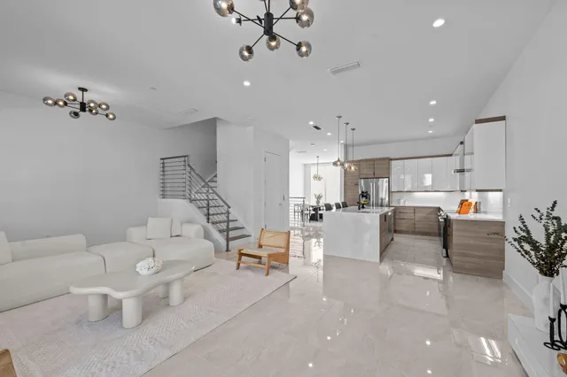 a living room with furniture and white walls