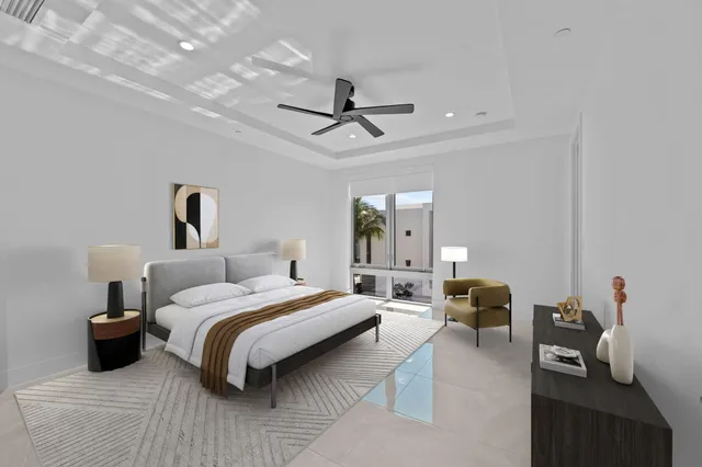 a bedroom with bed couch and window