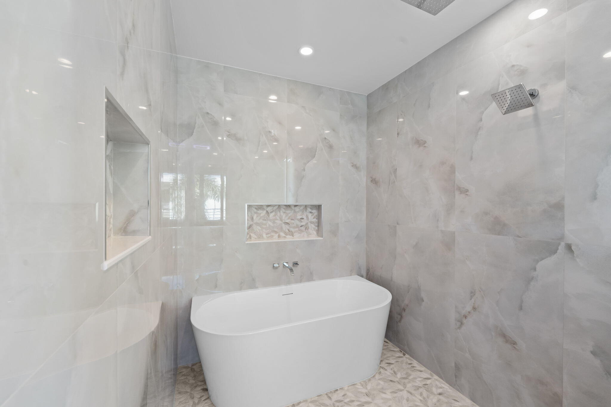 1731 Northwest 40th Drive Boca Raton, FL 33431 - Photo 20 of 26 a white bath tub sitting in a bathroom