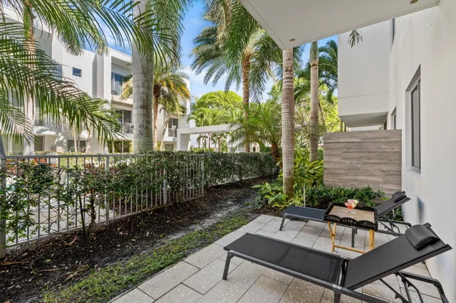 a view of a backyard with a patio
