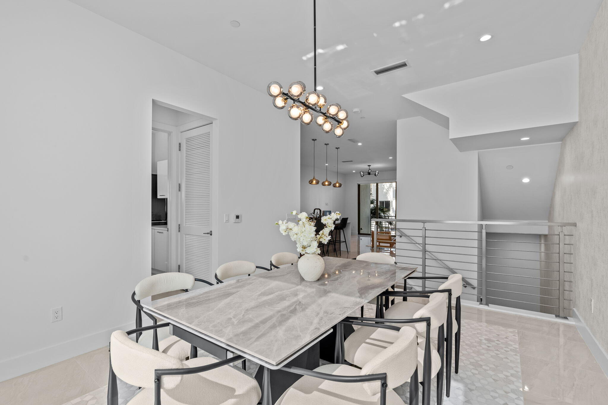 1731 Northwest 40th Drive Boca Raton, FL 33431 - Photo 9 of 26 a view of a dining room with furniture and chandelier